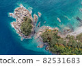Beautiful view of the Gamov Peninsula and a small rocky island. The Peter the Great Gulf. Bay Telyakovskogo in Russia.  82531683