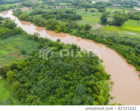 Aerial view river flood forest nature woodland area green tree, Top view river lagoon pond with water flood from above, Bird eye view landscape jungles lake flowing wild water after the rain Aerial view river flood forest nature woodland area green tree, Top view river lagoon pond with water flood from above, Bird eye view landscape jungles lake flowing wild water after the rain 82531831