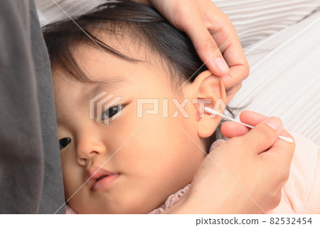 Children having their ears cleaned Children having their ears cleaned 82532454