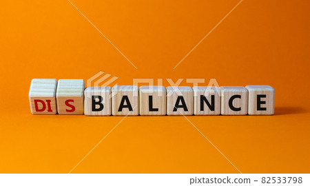 Balance or disbalance symbol. Turned cubes and changed the word disbalance to balance. Beautiful orange background, copy space. Business, balance or disbalance concept. Balance or disbalance symbol. Turned cubes and changed the word disbalance to balance. Beautiful orange background, copy space. Business, balance or disbalance concept. 82533798