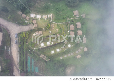 View of wooden resort on hill through foggy on rainy day at Khao Kho View of wooden resort on hill through foggy on rainy day at Khao Kho 82533849