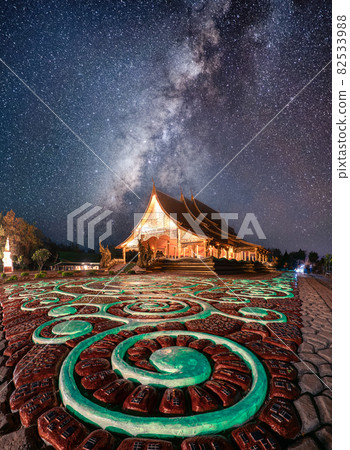Wat Sirindhorn Wararam Temple or Wat Phu Prao with milky way glowing over illuminated church in the night at Ubon Ratchathani Wat Sirindhorn Wararam Temple or Wat Phu Prao with milky way glowing over illuminated church in the night at Ubon Ratchathani 82533988