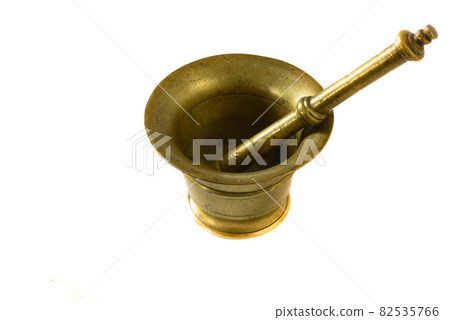 September 2021. copper mortar with pestle on a white background. September 2021. copper mortar with pestle on a white background. 82535766