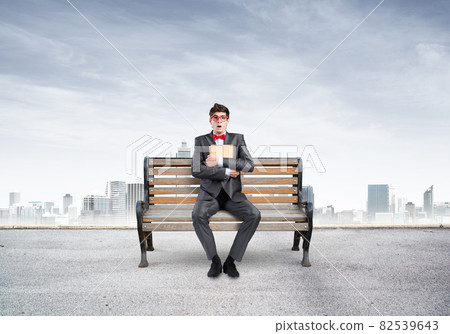 Young student with a book 82539643