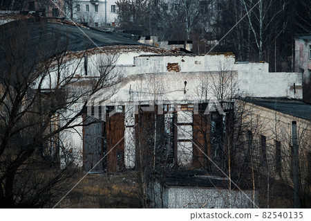 View of the gloomy abandoned buildings of the old factory 82540135