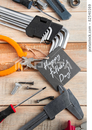 Set of work tools on a wooden background. Festive greeting card concept for Father's day 82540169