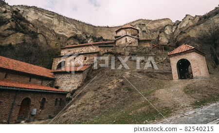 Mtskheta, Georgia. Shio-Mgvime Monastery. Upper Church Of Holy Virgin Or Theotokos, Central Part Of Medieval Monastic ShioMgvime Complex In Limestone Canyon Mtskheta, Georgia. Shio-Mgvime Monastery. Upper Church Of Holy Virgin Or Theotokos, Central Part Of Medieval Monastic ShioMgvime Complex In Limestone Canyon 82540215