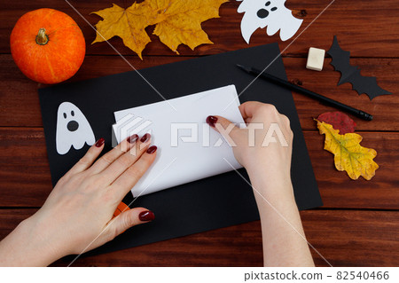 Halloween DIY. Step-by-step instructions for making a spider web from paper. Step 2. Halloween DIY. Step-by-step instructions for making a spider web from paper. Step 2. 82540466