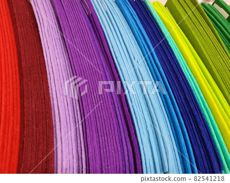 Pieces of colorful textile, samples of felt in different color for sewing in the hobby shop. Diy and handcraft concept. Closeup, fabric background Pieces of colorful textile, samples of felt in different color for sewing in the hobby shop. Diy and handcraft concept. Closeup, fabric background 82541218