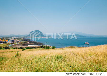 View of sea village and Sanbangsan Mountain in Jeju Island, Korea 82541345