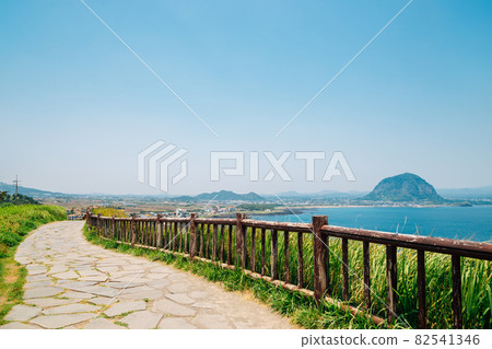 Songaksan Mountain trail with sea and Sanbangsan Mountain in Jeju Island, Korea 82541346
