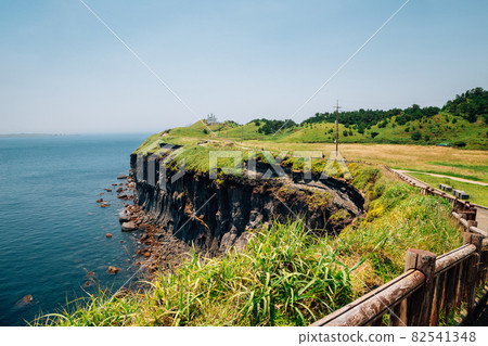 Songaksan Mountain trail with sea in Jeju Island, Korea 82541348