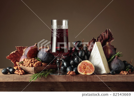 Red dessert wine with cheese brie and fruits. Red dessert wine with cheese brie and fruits. 82543669