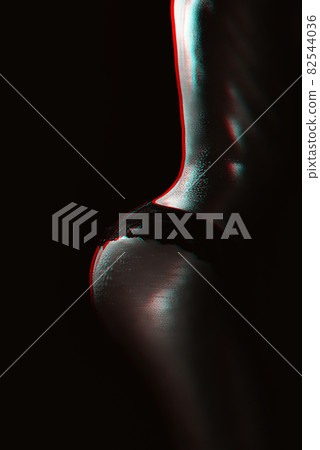Sexy buttocks of a girl in panties with water drops on her body close-up. Silhouette of a sporty slim female body 82544036