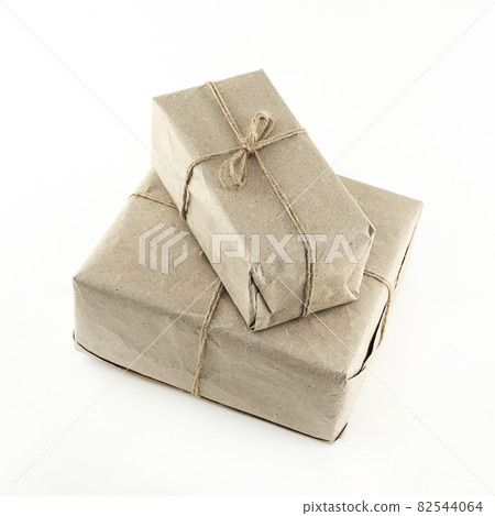 gift box in brown paper stack on white isolated background gift box in brown paper stack on white isolated background 82544064