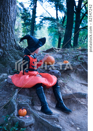 Girl in a witch costume. Beautiful picture for Halloween Girl in a witch costume. Beautiful picture for Halloween 82547242