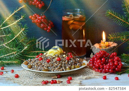 Decor in the form of stars from an orange peel. Compote uzvar drink from dried fruits and honey 82547384