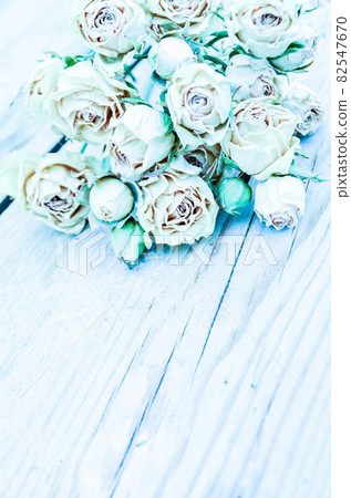 Withered rose on wooden background. Withered rose on wooden background. 82547670