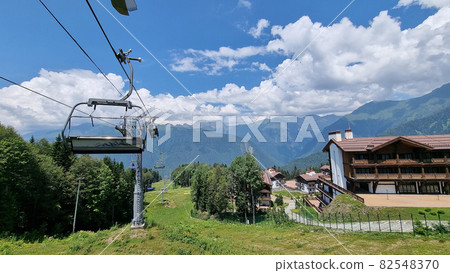cable car with open trailers in the mountains. cable car with open trailers in the mountains. 82548370