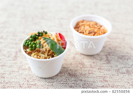 set of seasoning vegetables, caramelized onions and a set of mushrooms and a branch of green peppercorns 82550856