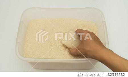Rice and measuring cup Rice and measuring cup 82556682