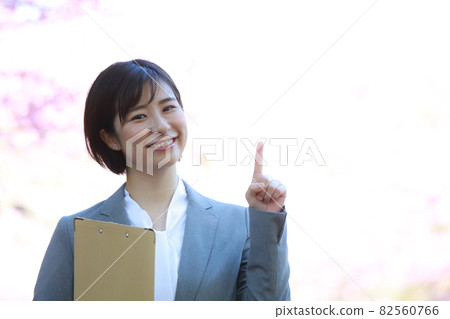 Female employee with a binder Female employee with a binder 82560766