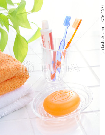 2 toothbrushes and soap 82564575