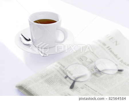 Coffee, newspaper and glasses Coffee, newspaper and glasses 82564584