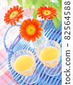 Orange juice and gerbera 82564588