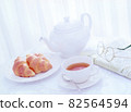 Teapots, croissants and newspapers 82564594