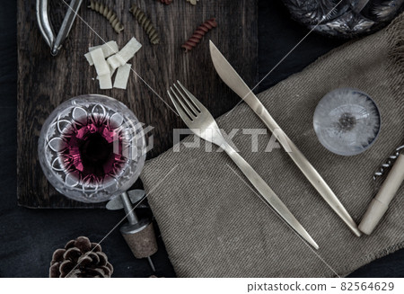 Flat lay composition with pitcher and glasses of red wine and corkscrew on wooden background : traditional winemaking and wine tasting concept. 82564629