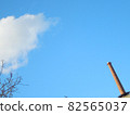 Chimneys, clouds and branches 82565037