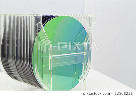 Silicon Wafers in plastic storage box in clear room of semiconductor foundry. 82568231
