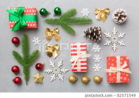 New Year composition. Christmas decor background with gift boxes. Top view with copy space New Year composition. Christmas decor background with gift boxes. Top view with copy space 82571549