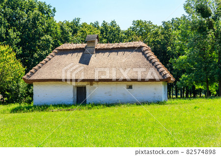 Ancient traditional ukrainian rural house in Pyrohiv (Pirogovo) village near Kiev, Ukraine Ancient traditional ukrainian rural house in Pyrohiv (Pirogovo) village near Kiev, Ukraine 82574898