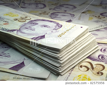 Singapore money. Singapore dollar banknotes. 2 SGD dollars bills. 82575956