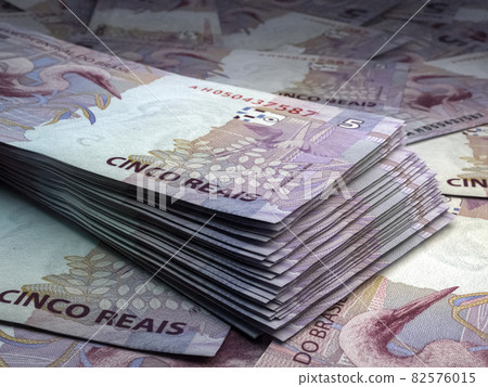 Brazilian money. Brazilian real banknotes. 5 BRL reals bills. 82576015
