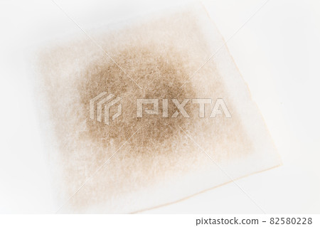 A photo of a dirty filter attached to a ventilator. A photo of a dirty filter attached to a ventilator. 82580228