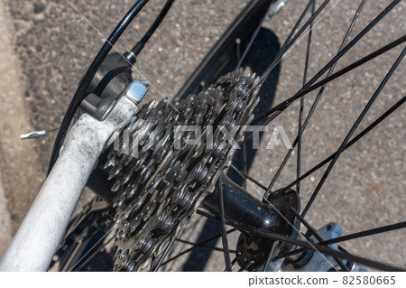 A photo of a dirty sprocket (gear) on a bicycle. Image of a bicycle. 82580665
