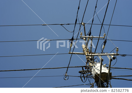 Upper part of utility pole, equipment, sunny, sunny, up Upper part of utility pole, equipment, sunny, sunny, up 82582776