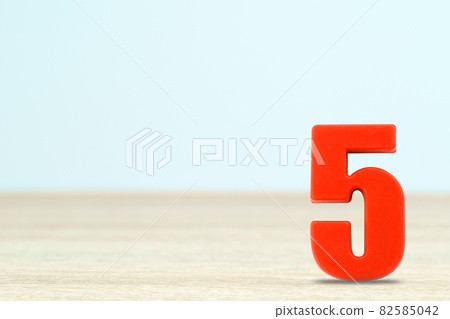 Shot of a number five made of red plastic 82585042