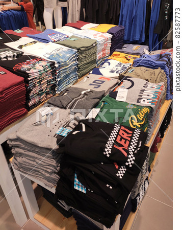SELANGOR, MALAYSIA - MARCH 29, 2021: Selected focused on children's clothing being sold in a supermarket. Has a price tag. Sorted by brand, type, size, and age. SELANGOR, MALAYSIA - MARCH 29, 2021: Selected focused on children's clothing being sold in a supermarket. Has a price tag. Sorted by brand, type, size, and age. 82587773