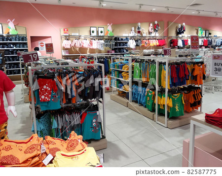 SELANGOR, MALAYSIA - MARCH 29, 2021: Selected focused on children's clothing being sold in a supermarket. Has a price tag. Sorted by brand, type, size, and age. SELANGOR, MALAYSIA - MARCH 29, 2021: Selected focused on children's clothing being sold in a supermarket. Has a price tag. Sorted by brand, type, size, and age. 82587775