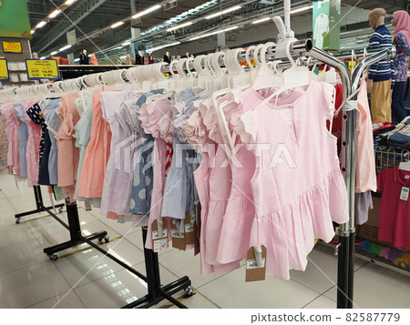 SELANGOR, MALAYSIA - MARCH 29, 2021: Selected focused on children's clothing being sold in a supermarket. Has a price tag. Sorted by brand, type, size, and age. SELANGOR, MALAYSIA - MARCH 29, 2021: Selected focused on children's clothing being sold in a supermarket. Has a price tag. Sorted by brand, type, size, and age. 82587779