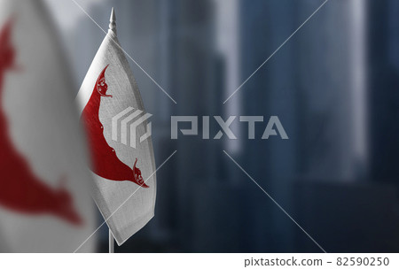 Small flags of Easter Island on a blurry background of the city 82590250