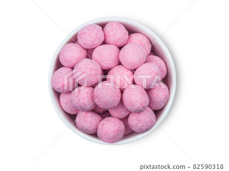 Round Sweet Strawberry Raspberry Bonbons candies in white ceramic plate on white background. Round Sweet Strawberry Raspberry Bonbons candies in white ceramic plate on white background. 82590318