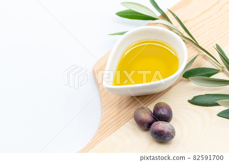 Olive oil photo taken on a white background with a copy space Olive oil photo taken on a white background with a copy space 82591700