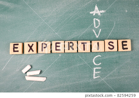 Advice and Expertise. Wooden alphabet letters on a green chalk board Advice and Expertise. Wooden alphabet letters on a green chalk board 82594259