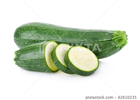 Green zucchini with slice isolated on white background Green zucchini with slice isolated on white background 82610235