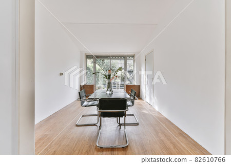 Modern dining room in a luxury house with individual design Modern dining room in a luxury house with individual design 82610766